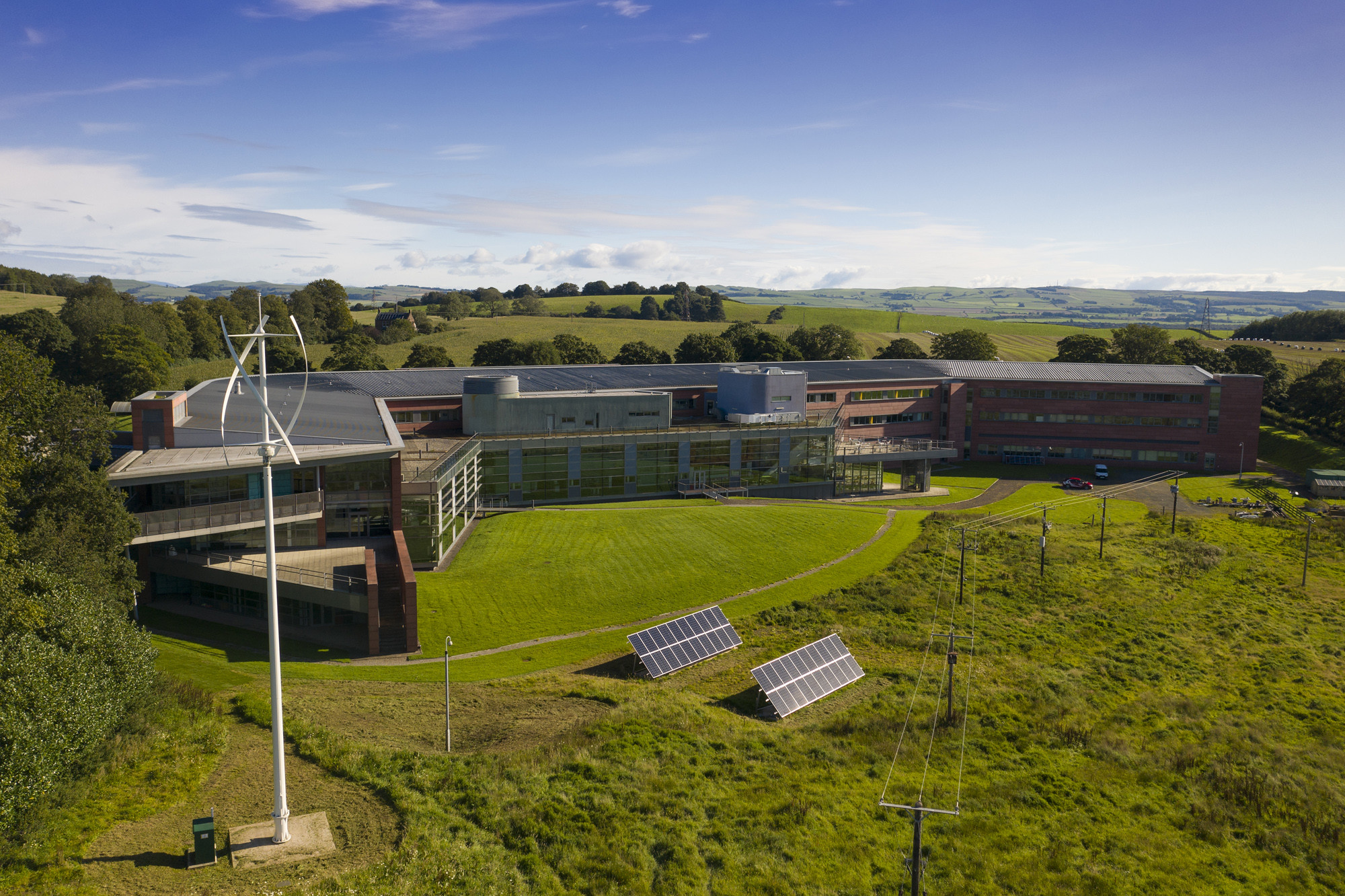 Dumfries and Galloway College Crichton Campus with the wind turbine in front.